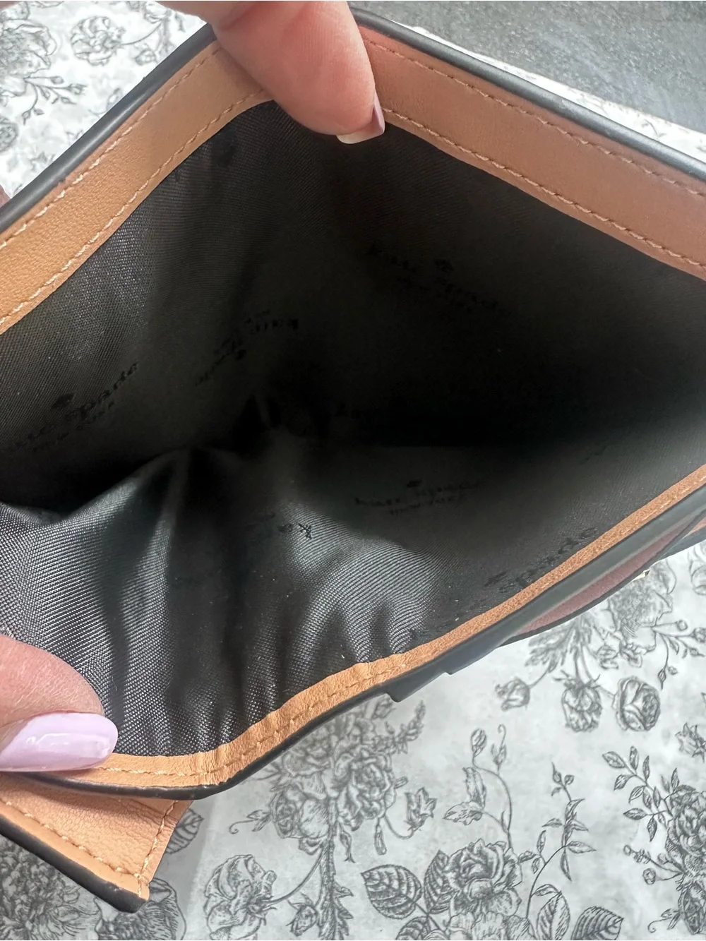kate spade Black Pebbled Leather Continental Wallet with Gold Logo